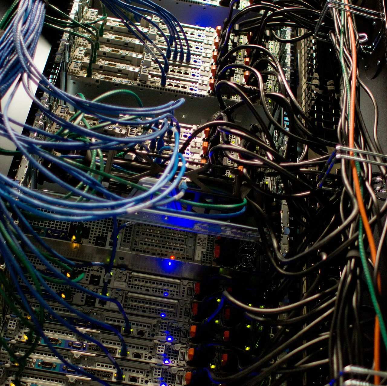 Server racks with structured cabling in a data facility